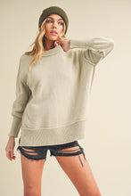 Load image into Gallery viewer, The Ina sweater effortless blends charm and versatility. She's designed as a adorable pullover style, boxy, slouchy silhouette, exposed seams and side slits, it's a wardrobe essential. Transition effortlessly from gym sessions to fun girls nights out, emb