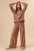 Load image into Gallery viewer, This two-tone Cozy cord rib set blends elevated comfort with effortless style. Designed with a flattering V-neck top and eye-catching contrast stitching, it adds just the right amount of detail to a laid-back look. The soft, ribbed fabric offers stretch and te