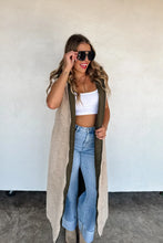 Load image into Gallery viewer, Stay warm in bold style with the ultra-cozy long sherpa puffer vest. Quilted puffer on one side, or wear it reversed with the sherpa side facing out! Features side pockets on the puffer side with a full zipper. Reverse the vest to wear the sherpa on the