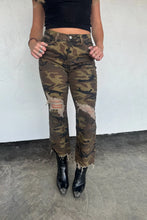 Load image into Gallery viewer, One of our all time best selling jeans now comes in a CAMO distressed style! So many of you have requested this same style and we are happy to accomodate...so voila! These jeans feature a crop flare style, raw ankle hem and semi high rise waist FIT: