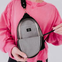 Load image into Gallery viewer, this versatile bag will be here for all your adventures as you can wear it for any and all occasions. It comes with a removable solid canvas strap, open interior pocket, and sliding O-ring for ultimate convenience while it allows you to wear your sling ba