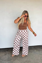 Load image into Gallery viewer, These washed printed pants scream ultimate comfort and style. These trendy pants feature side sesam piping details, side pockets and elastic waist with tie string. Waist is designed to be "rolled" but can absolutely be unrolled as well. The BEST parte is