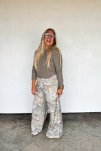 Load image into Gallery viewer, These washed printed pants scream ultimate comfort and style. These trendy pants feature side sesam piping details, side pockets and elastic waist with tie string. Waist is designed to be "rolled" but can absolutely be unrolled as well. The BEST parte is