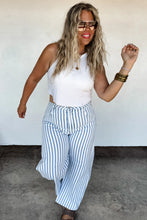 Load image into Gallery viewer, These trendy stripe barrels have more of a mid-rise fit, semi stretchy denim, and wide-legs that taper at the ankle. Darted at the knees to keep the "flare out" form. Features beltloops and detailed seams on sides. High quality look! Medium wash with a d
