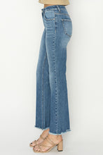 Load image into Gallery viewer, Mid Rise Fray Hem Boot Cut Jeans.