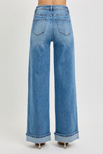 Load image into Gallery viewer, These Michelle - Risen High Rise jeans feature a high rise design with tummy control for a flattering fit. The wide cuff detail adds style and versatility, with an 11" rise for comfortable coverage. The inseam measures 32.5" before cuffing and extends to 35" when the cuff is released, allowing for customizable length. Perfect for those seeking both function and fashion in their denim.