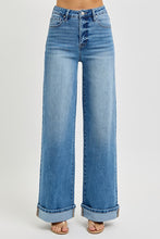Load image into Gallery viewer, These Michelle - Risen High rise jeans feature a high rise design with tummy control for a flattering fit. The wide cuff detail adds style and versatility, with an 11" rise for comfortable coverage. The inseam measures 32.5" before cuffing and extends to 35" when the cuff is released, allowing for customizable length. Perfect for those seeking both function and fashion in their denim.