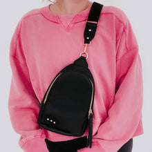 Load image into Gallery viewer, this versatile bag will be here for all your adventures as you can wear it for any and all occasions. It comes with a removable solid canvas strap, open interior pocket, and sliding O-ring for ultimate convenience while it allows you to wear your sling ba
