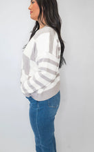 Load image into Gallery viewer, Get ready to conquer the day in style with our Mocha Checkmate Stripes Sweater by Salty Wave! Made with soft, high-quality fabric, this sweater features a trendy checkmate with a stripe pattern on arms that will make you stand out from the crowd. Perfect 
