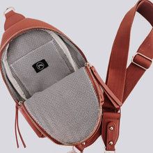 Load image into Gallery viewer, this versatile bag will be here for all your adventures as you can wear it for any and all occasions. It comes with a removable solid canvas strap, open interior pocket, and sliding O-ring for ultimate convenience while it allows you to wear your sling ba
