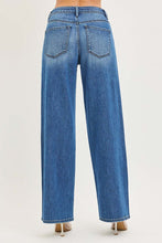 Load image into Gallery viewer, Baggy - The Emery - Risen Jeans viewed from the back, featuring a wide-leg fit and classic blue denim.
