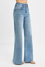 Load image into Gallery viewer, These Risen high-rise wide-leg jeans feature a flattering front yoke detail that adds structure and style. The relaxed fit flows effortlessly from hip to hem, creating a modern, on-trend silhouette. Designed for comfort without sacrificing chic, they’re perfect
