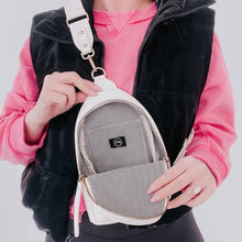 Load image into Gallery viewer, this versatile bag will be here for all your adventures as you can wear it for any and all occasions. It comes with a removable solid canvas strap, open interior pocket, and sliding O-ring for ultimate convenience while it allows you to wear your sling ba

